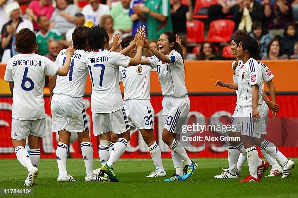 Homare Sawa of Japan celebrates her team's third goal with team mates during the FIFA Women's World Cup 2011 Group B match between Japan and Mexico...