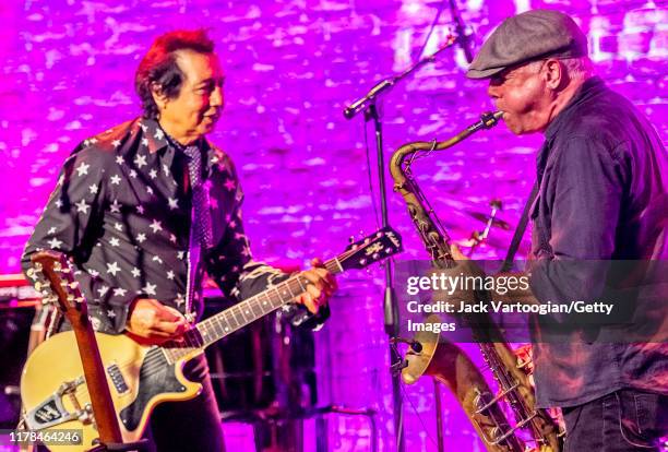 American Alt-Country and -Rock musician Alejandro Escovedo , on guitar, and Danny Ray, on tenor saxophone, both of the former's band, perform at the...