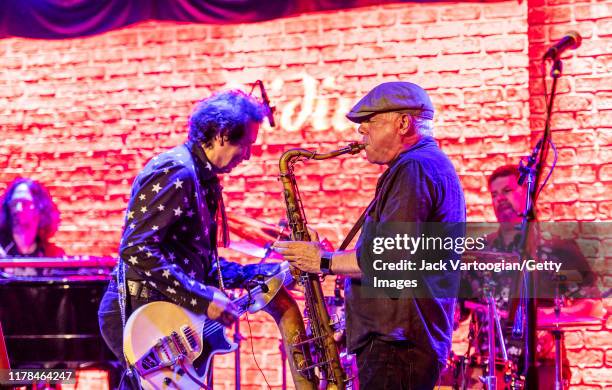 American Alt-Country and -Rock musician Alejandro Escovedo , on guitar, and Danny Ray , on tenor saxophone, both of the former's band, perform at the...