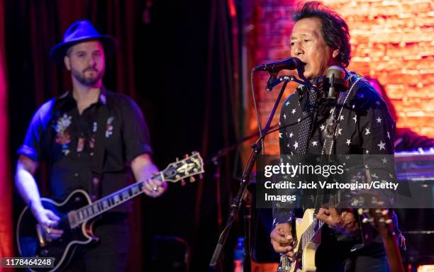 Alt-Country and -Rock musicians Derek Cruz and Alejandro Escovedo, both on guitar and from the altter's band, perform at the Iridium nightclub, New...