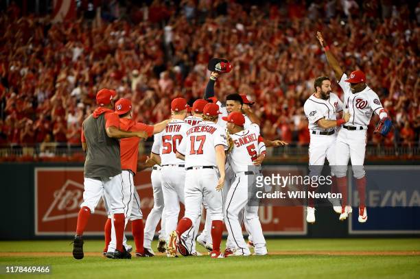 Juan Soto of the Washington Nationals celebrates with his teammates after defeating the Milwaukee Brewers with a score 4 to 3 in the National League...