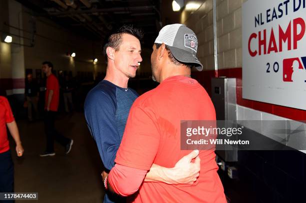Craig Counsell of the Milwaukee Brewers congratulates Dave Martinez of the Washington Nationals after the National League Wild Card game at Nationals...
