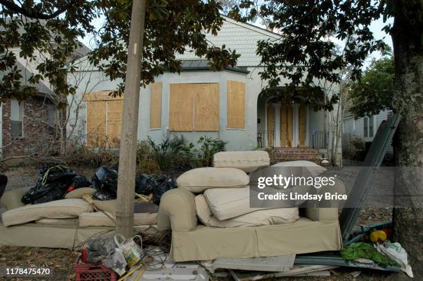 Upholstered furniture out of the house and onto the curb after flooding during Hurricane Katrina on September 13, 2005 in Metairie, Louisiana.