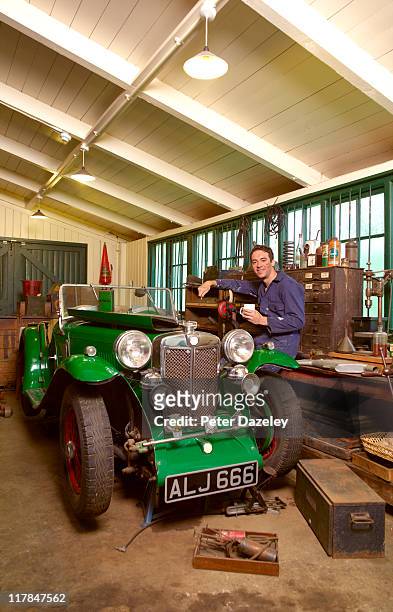 classic car collector working on car - classic car restoration stockfoto's en -beelden