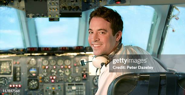 pilot at control of jet aeroplane - airplane cockpit stock pictures, royalty-free photos & images