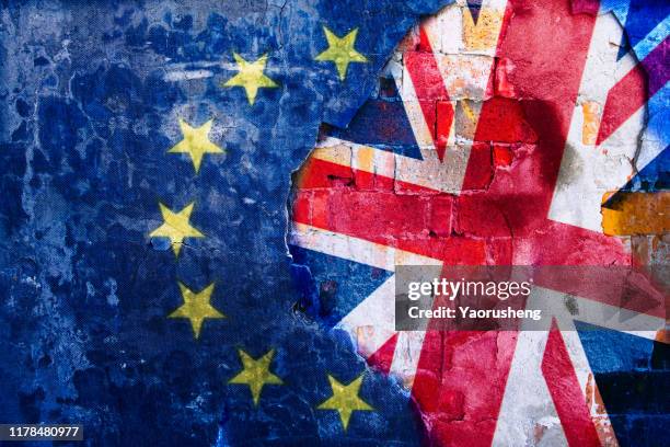 brexit, flags of the united kingdom and the european union on cracked background - brexit fotografías e imágenes de stock