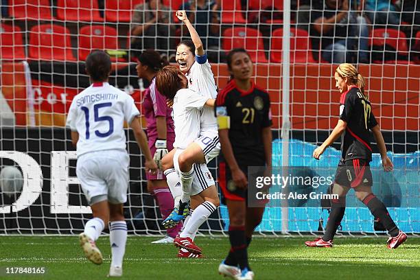 Homare Sawa of Japan celebrates her team's fourth goal with team mates Nahomi Kawasumi and Aya Sameshima during the FIFA Women's World Cup 2011 Group...