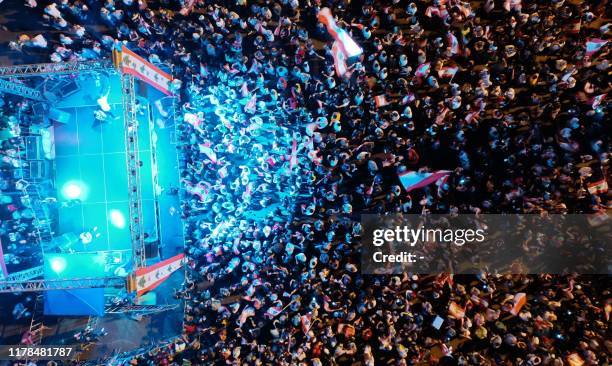 An aerial view shows Lebanese demonstrators attending gathered at Martyrs' Square in the centre of the capital Beirut on October 27 during ongoing...
