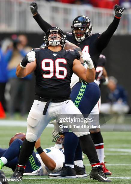 Tyeler Davison of the Atlanta Falcons reacts after making a sack in the second half of an NFL game against the Seattle Seahawks at Mercedes-Benz...