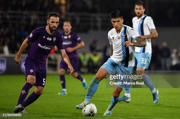 Luis Alberto of SS Lazio compete for the ball with Milan Badelij of Fiorentina ACF during the Serie A match between ACF Fiorentina and SS Lazio at...
