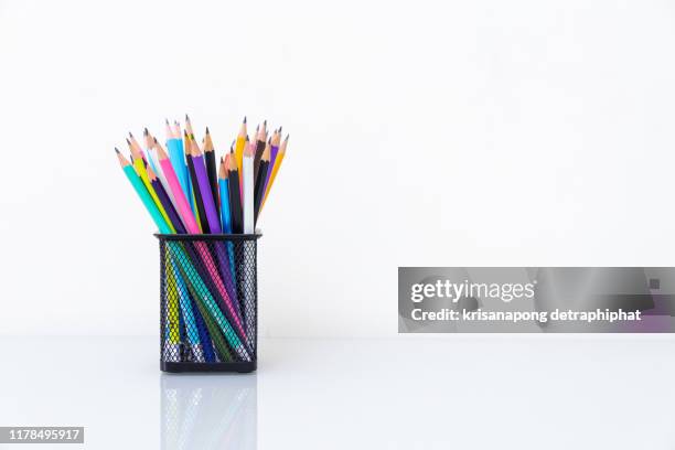 various colored pencils isolated on white background - colored pencil foto e immagini stock