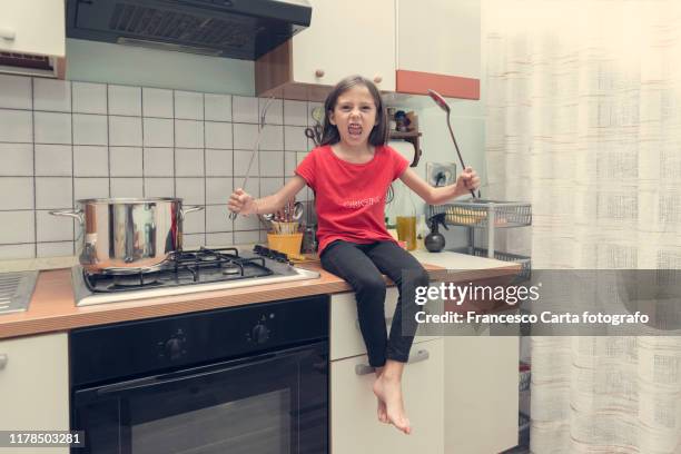 little girl playing in the kitchen - kid singing stock pictures, royalty-free photos & images