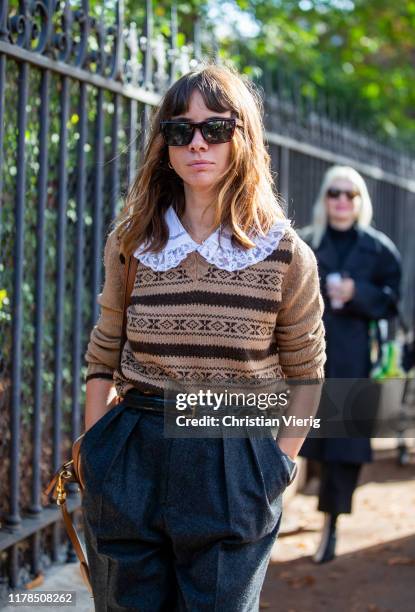 Natasha Goldenberg seen wearing brown knit, navy pants outside Lacoste during Paris Fashion Week Womenswear Spring Summer 2020 on October 01, 2019 in...