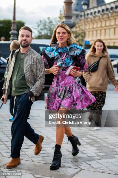 Anna dello Russo is seen wearing multi colored pink black blue dress with print outside Louis Vuitton during Paris Fashion Week Womenswear Spring...