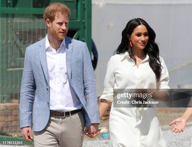 Prince Harry, Duke of Sussex and Meghan, Duchess of Sussex visit a township to learn about Youth Employment Services on October 02, 2019 in...