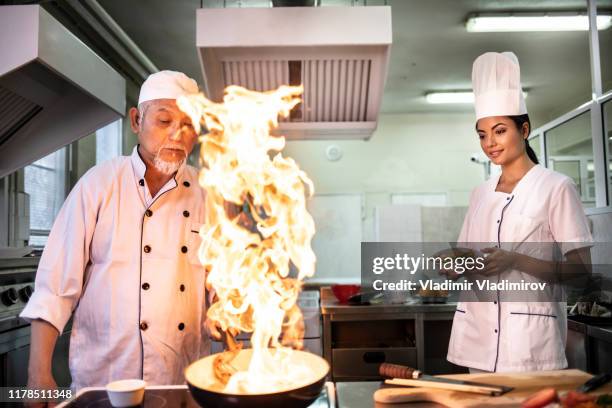 Chef Buring Building China Wok Photos and Premium High Res Pictures - Getty Images