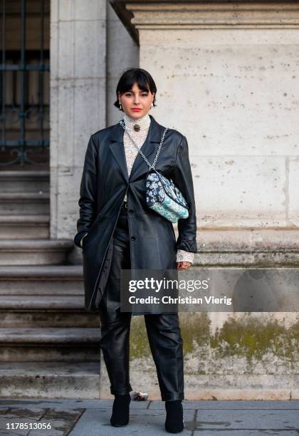 Maria Bernad seen wearing black leather jacket, turtleneck knit, Louis Vuitton bag with print, pants outside Louis Vuitton during Paris Fashion Week...