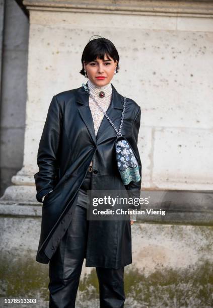 Maria Bernad seen wearing black leather jacket, turtleneck knit, Louis Vuitton bag with print, pants outside Louis Vuitton during Paris Fashion Week...