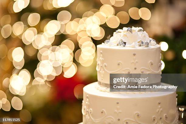 wedding cake and bokeh - wedding cake stock pictures, royalty-free photos & images