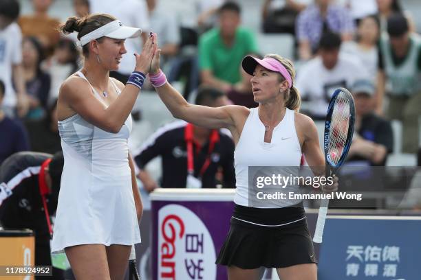 Nicoloe Melichar of USA and Kveta Peschke of Czech Republic celebrate after winning their Women's doubles match against Julia Goerges of Germany and...