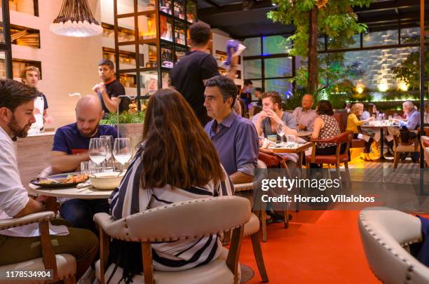 Patrons have dinner at "O Asiatico", a thematic restaurant favored by locals and tourists who are into Asian flavors in Principe Real neighborhood,...