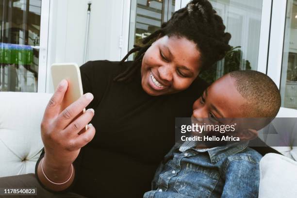 Happy mother and son getting some face time on cell phone
