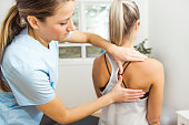 A Modern rehabilitation physiotherapist at work with client