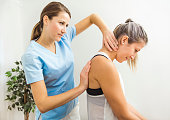 A Modern rehabilitation physiotherapist at work with client
