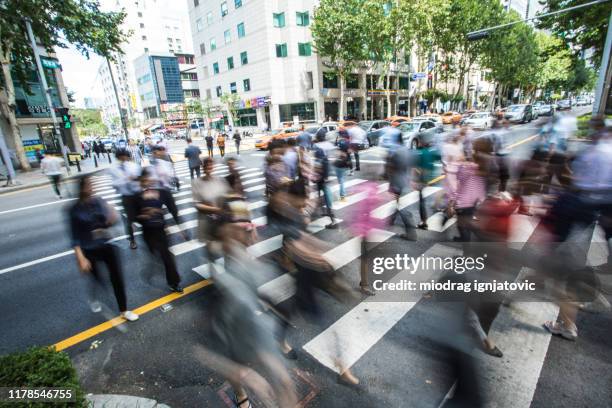 pedestrian crossing street in seoul - south korea people stock pictures, royalty-free photos & images