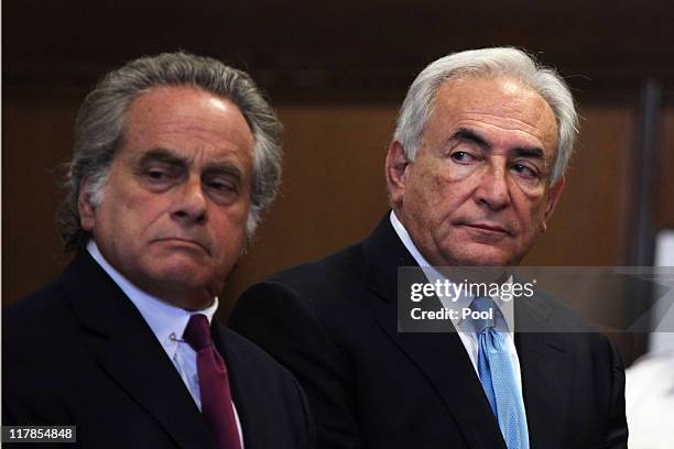 Former IMF Chief Dominique Strauss-Kahn stands with his lawyer Benjamin Brafman in Manhattan Supreme Court July 1, 2011 in New York City....