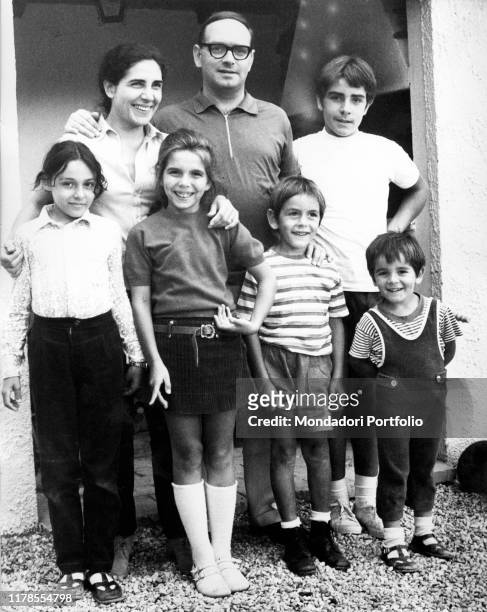 Italian composer, musician, conductor Ennio Morricone with his family: his wife Maria Travia, his sons Marco, Andrea, and Giovanni, and his daugher...