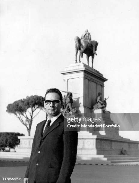 Italian composer, musician and conductor Ennio Morricone stands in front of Giuseppe Garibaldi equestrian statue on top of Gianicolo hill. Rome, 1966