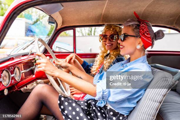 pin up girls in a vintage car stock photo - rockabilly pin up girls stock pictures, royalty-free photos & images