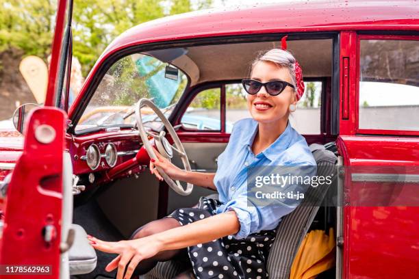 pin up girl in a vintage car stock photo - rockabilly pin up girls stock pictures, royalty-free photos & images
