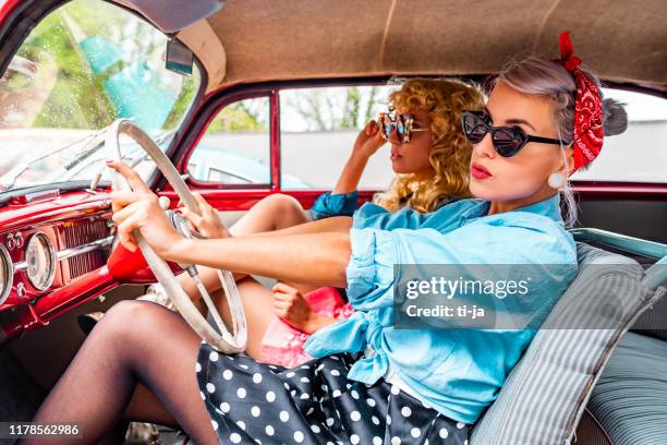 pin up girls in a vintage car stock photo - rockabilly pin up girls stock pictures, royalty-free photos & images