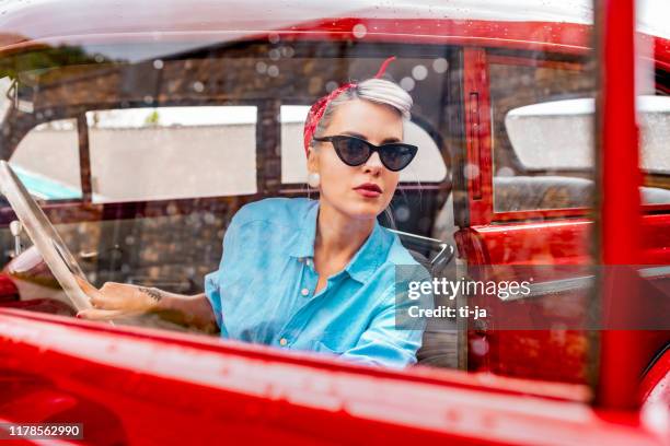 pin up girl in a vintage car stock photo - rockabilly pin up girls stock pictures, royalty-free photos & images