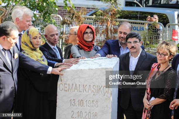 Hatice Cengiz , the fiancee of murdered Saudi journalist Jamal Khashoggi, CEO of Amazon and Washington Post owner Jeff Bezos , and participants stand...