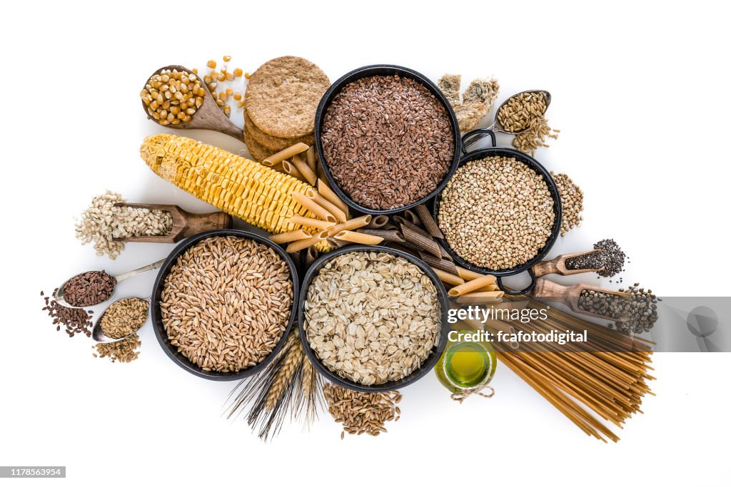 Dietary fiber: large group of wholegrain food shot from above on white background