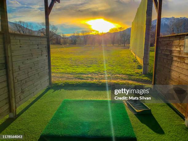 driving range with sunlight and mountain - mats silvan stock pictures, royalty-free photos & images