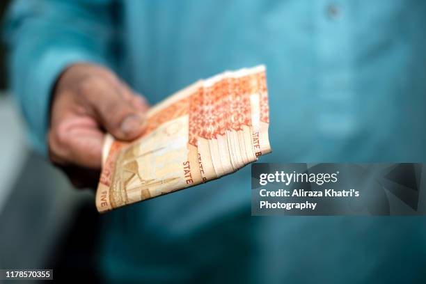 showing currency - pakistan currency stock pictures, royalty-free photos & images