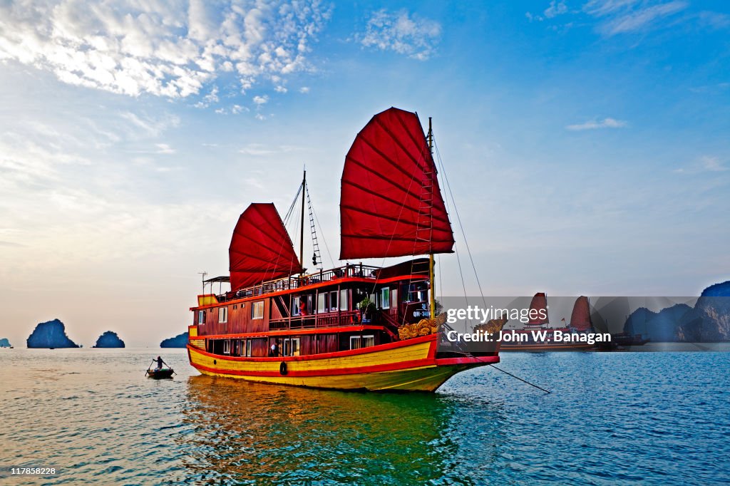 Boat with red sails Halong Bay