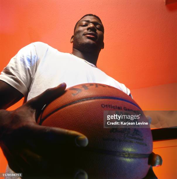 Basketball star Larry Johnson poses for a portrait for the premiere issue of Slam Magazine on November 18, 1993 in Charlotte, North Carolina. Johnson...