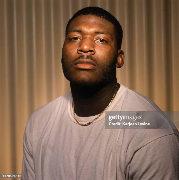 Basketball star Larry Johnson poses for a portrait for the premiere issue of Slam Magazine on November 18, 1993 in Charlotte, North Carolina. Johnson...