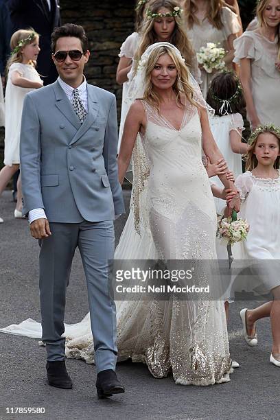Kate Moss and Jamie Hince outside the church after their wedding on July 1, 2011 in Southrop, England.