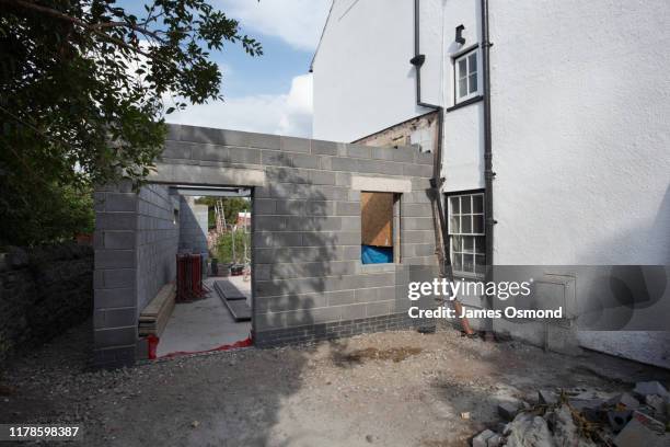 extension being built onto the side of a listed period property, mid project. - wall renovation stock pictures, royalty-free photos & images