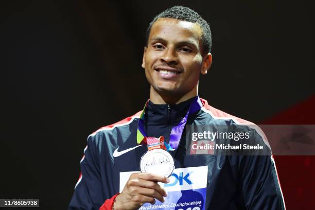 Silver medalist Andre De Grasse of Canada stands on the podium during the medal ceremony for the Men's 200 metres final during day six of 17th IAAF...