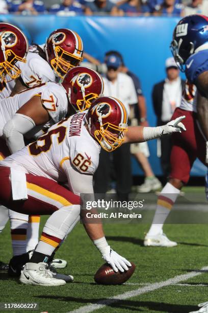 Center Tony Bergstrom of the Washington Redskins is set to snap the ball against the New York Giants in the second half at MetLife Stadium on...