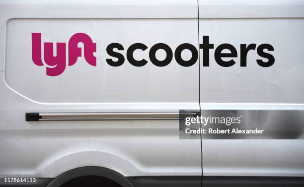 Lyft scooters delivery and service van in downtown Denver, Colorado.