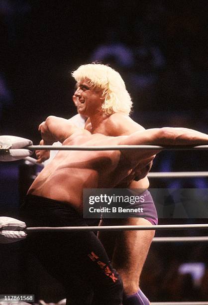 The "Nature Boy" Rick Flair gets ready to hit Road Warrior Hawk in the corner during their Heavy Weight bout at the 1988 Bunkhouse Stampede on...