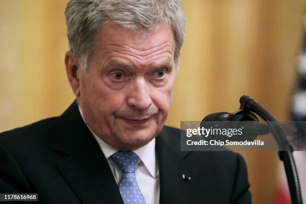 Finnish President Sauli Niinisto speaks during a joint news conference with U.S. President Donald Trump in the East Room of the White House October...
